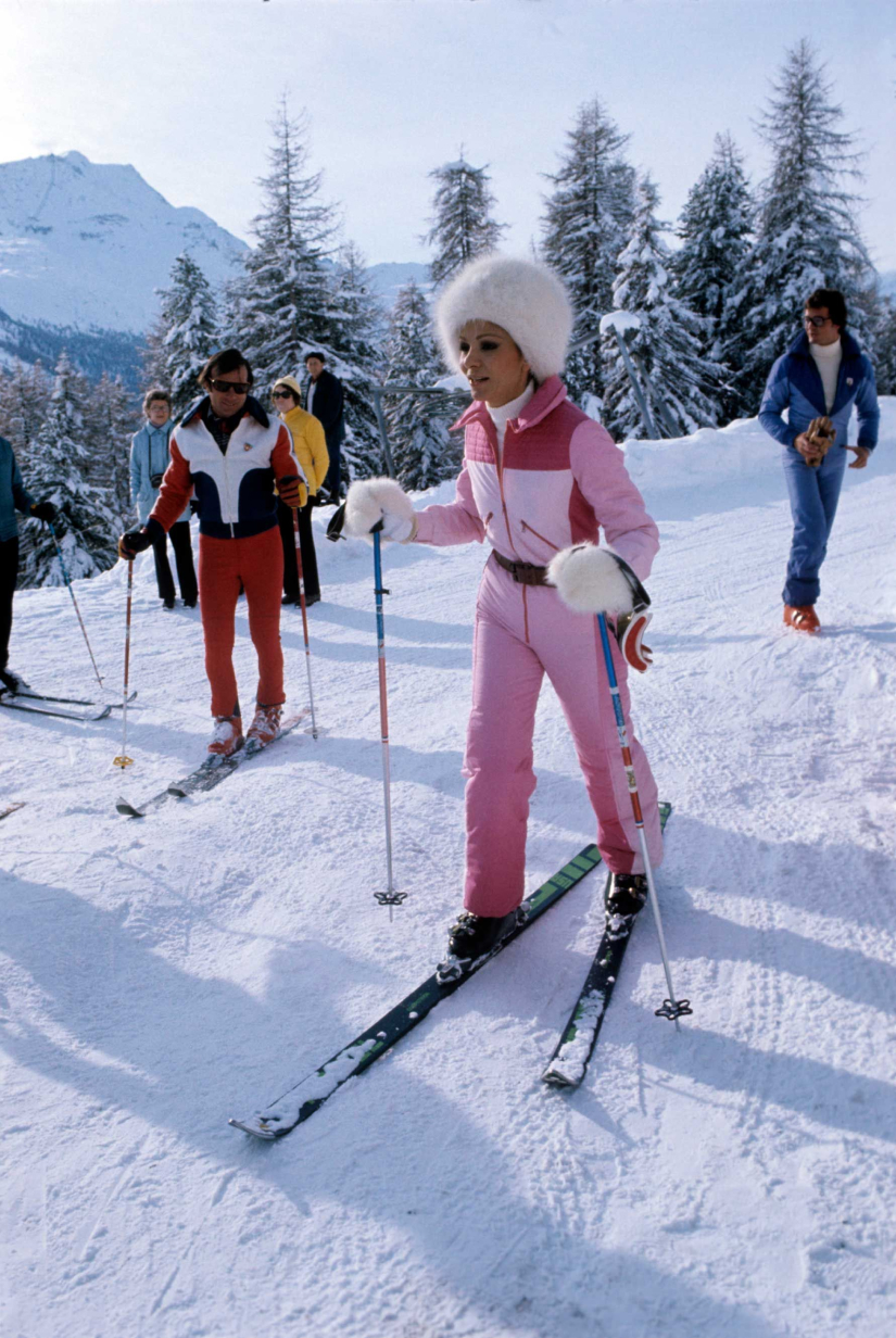Vintage skier wearing pink ski set